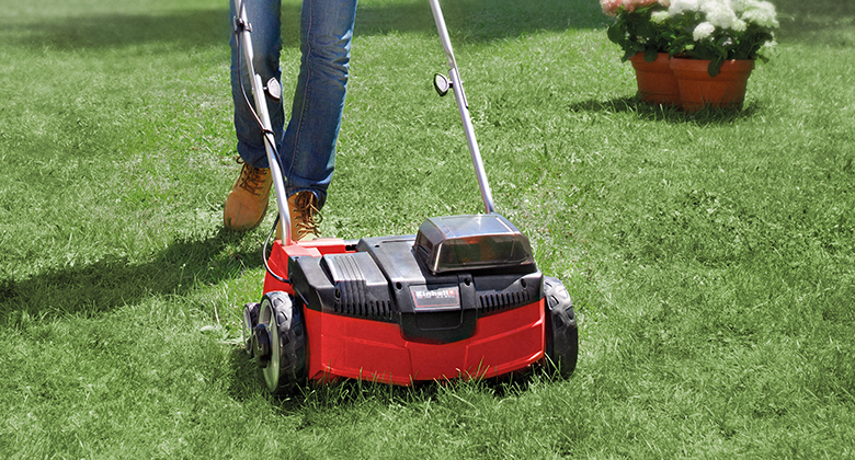 cordless scarifier used in a garden