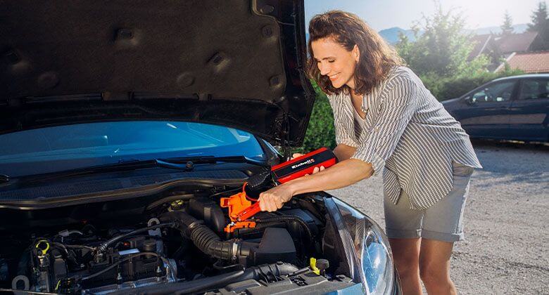 woman working with jump starter